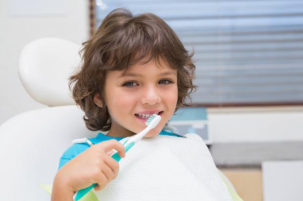 Child with a toothbrush Pediatric Dentistry Services in Round Rock, TX